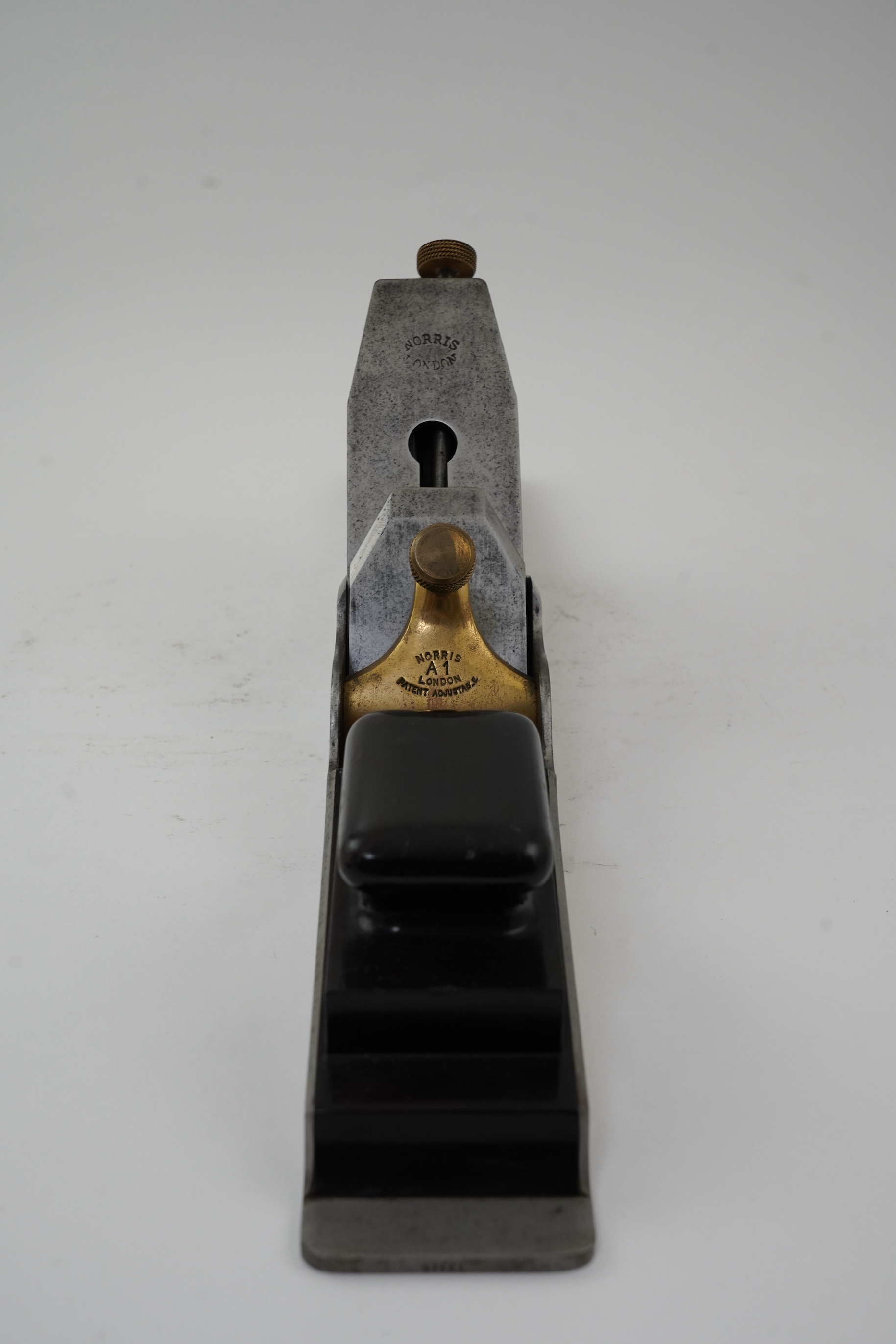 A Norris A1 adjustable 22 1/2” jointer plane with rosewood infill and handle, stamped with Norris, London to both the brass lever cap and the iron